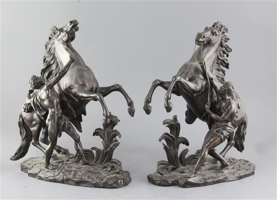 After Coustou. A pair of bronze Marli horse groups, 15in.